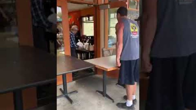 'Guy yelling at Chinese restaurant owners for delay on food order.'