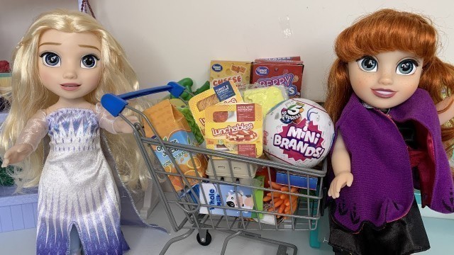 'Elsa and Anna toddlers go Grocery Shopping Lunchables Food'