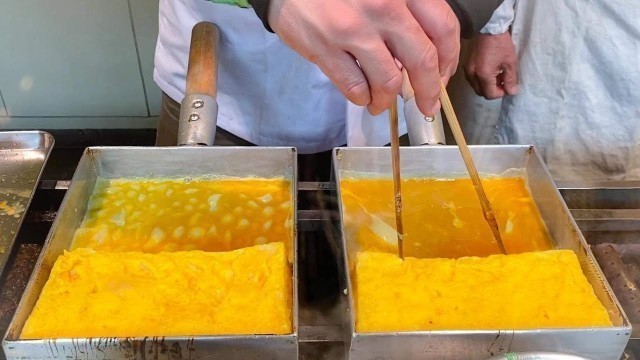 'japanese street food -  TAMAGOYAKI rolled omelette  玉子焼き'