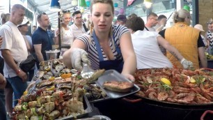 'Huge Pans Cooking Huge Doses of Fish.  Kiev Street Food, Ukraine'