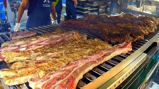 'Italy Street Food Event. Huge Blocks of Meat on Grill, Asado, Super Loaded Sandwiches and more Food'