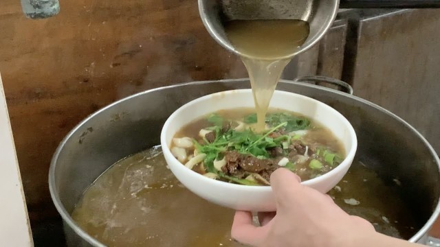 'Chinese Street Food - Hot  Sliced noodles with pickles in Hefei China'