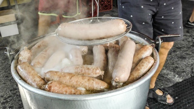 'Italy Street Food. Huge Blocks of Meat, Giant Sausages Cooked and Cut'