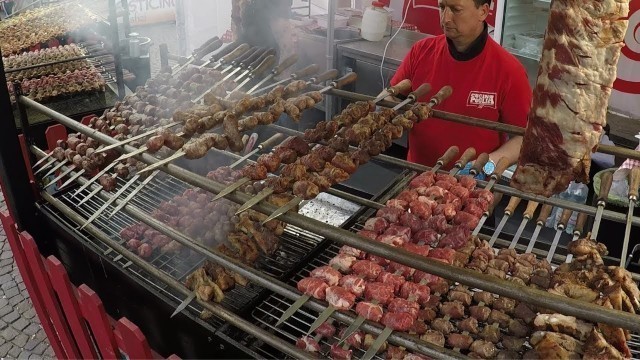 'Italy Street Food. Pig Knuckles, Lamb, Pork Skewers, Melted Cheese, Focaccia, Dry-Cured Ham, Paella'