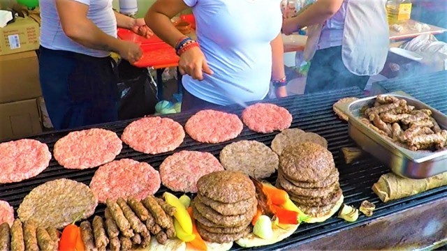 'Large Burgers, Roast Beef Blocks, Pork Knuckles, Churrasco, Grilled Octopus. Italy Street Food'