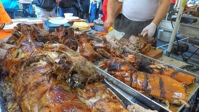 'Serbian Masters Roast Huge Dose of Porks and Lambs. Street Food Fair in Italy'