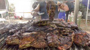 'Huge Grill of Meat from Argentina. Italy Street Food Festival'