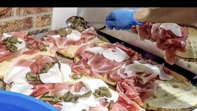 'Italy Street Food. Huge Dose of Overloaded \'Spianata\' Flat Bread with Ham, Cheese and More'