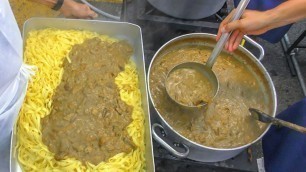 'Cooking Huge Pans of Pasta with Mushrooms for Thousands of People. Italy Street Food Festival'