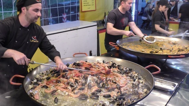 'Huge Pans. Cooking Paella Valenciana. Italy Street Food'