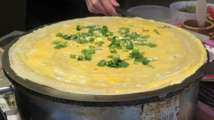 'London Street Food. China Style Pancake with Eggs seen in Chinatown'