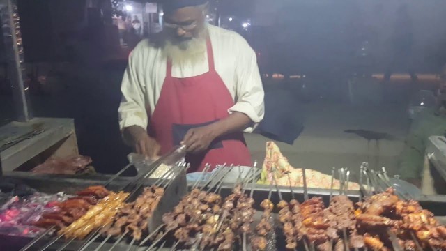 'Poor Old Men Selling Barbecue at Street Food of Karachi Pakistan'