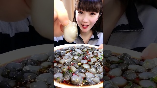 'A Chinese girl eating different types of non - vegetarian food | Octopus, Snake, Many other'